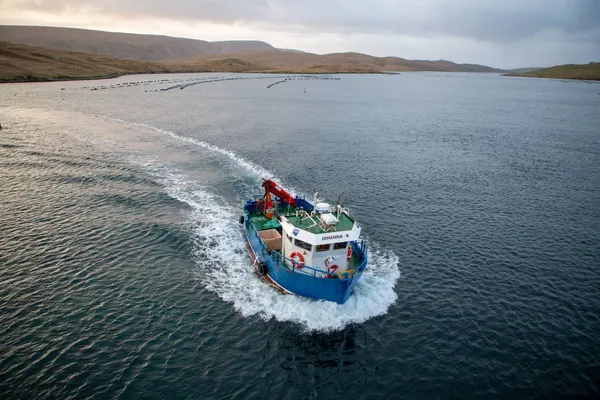 Workboat leaving the shorebase