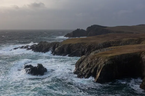 Stormy seas and cliffs