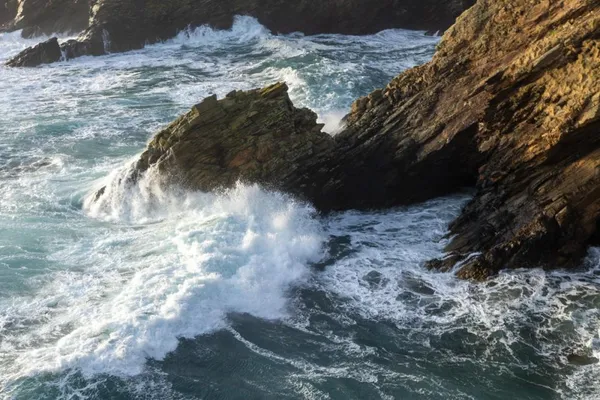 Waves crashing on the headland